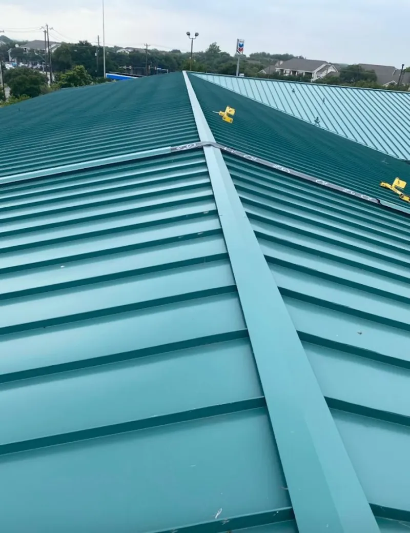 Green commercial metal roof ridge and valley for Metal Roof Repair in Prospect Heights