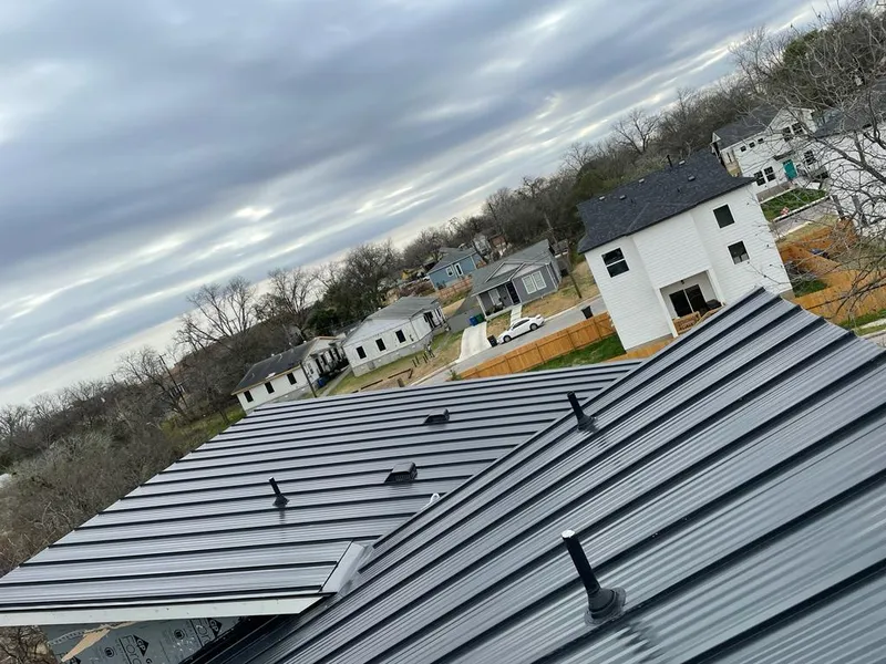 Standing seam metal roof panels with vents for Skylight Repair in Prospect Heights